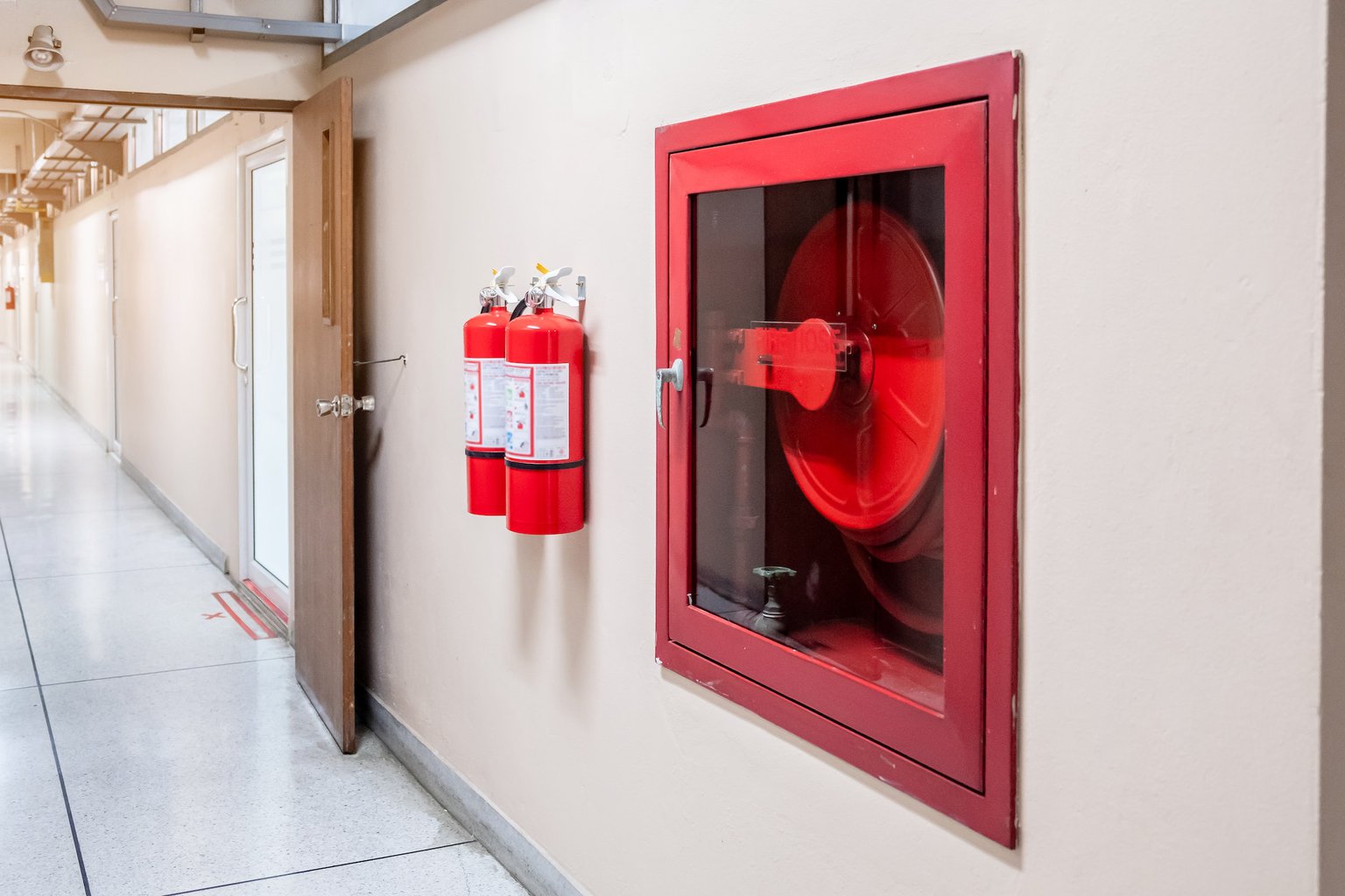 Fire extinguisher system on the wall background,